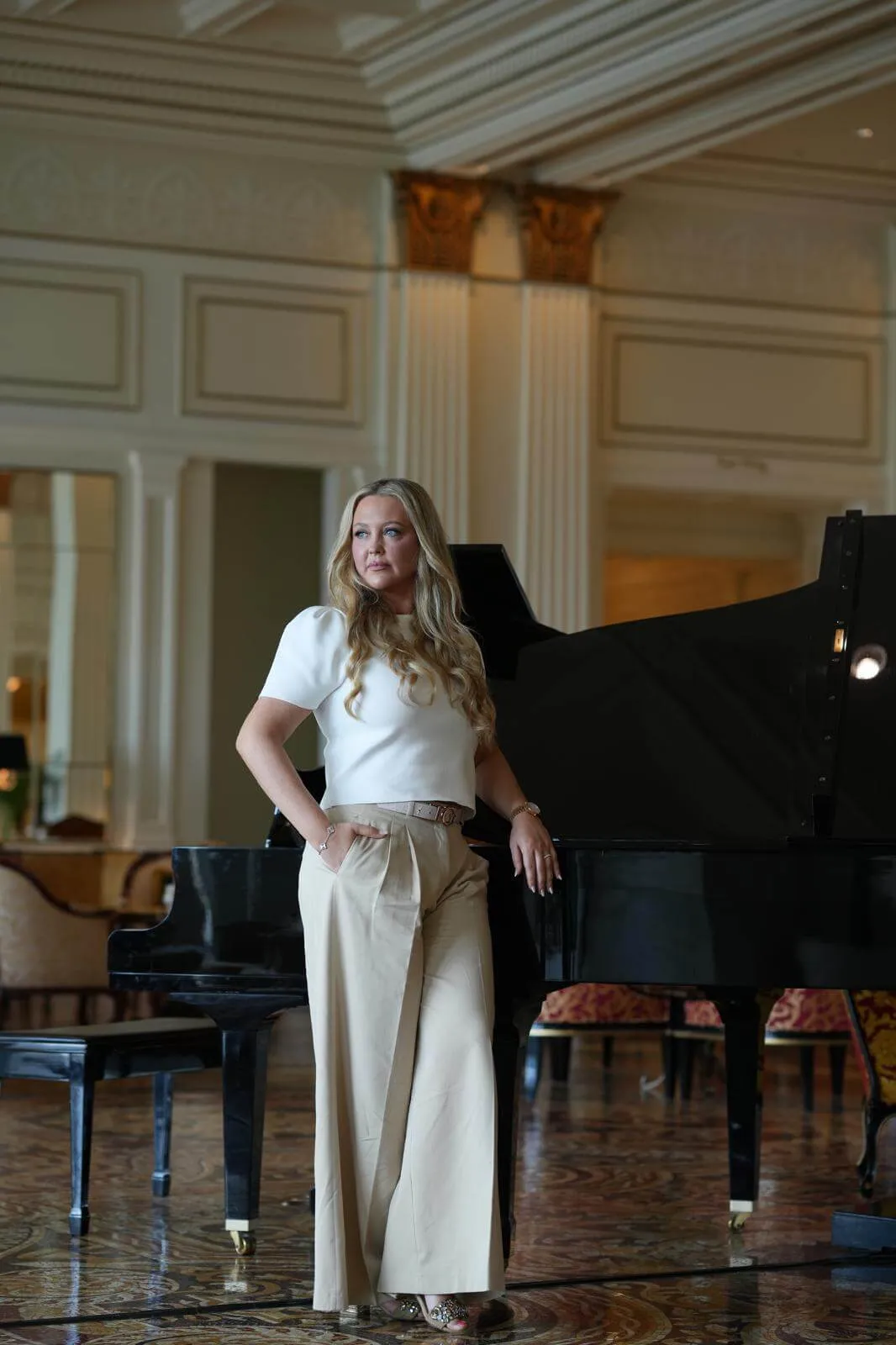 The founder of Bridal Edit Studio, in a columned hotel hall in Dubai